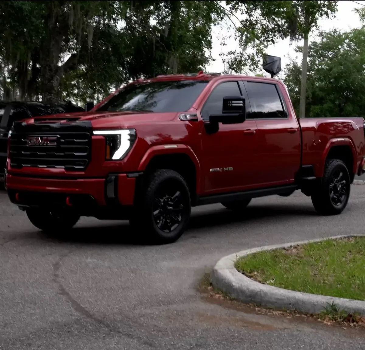 Mobile ceramic coating results in Kissimmee, FL - mirror finish on dark red GMC Sierra